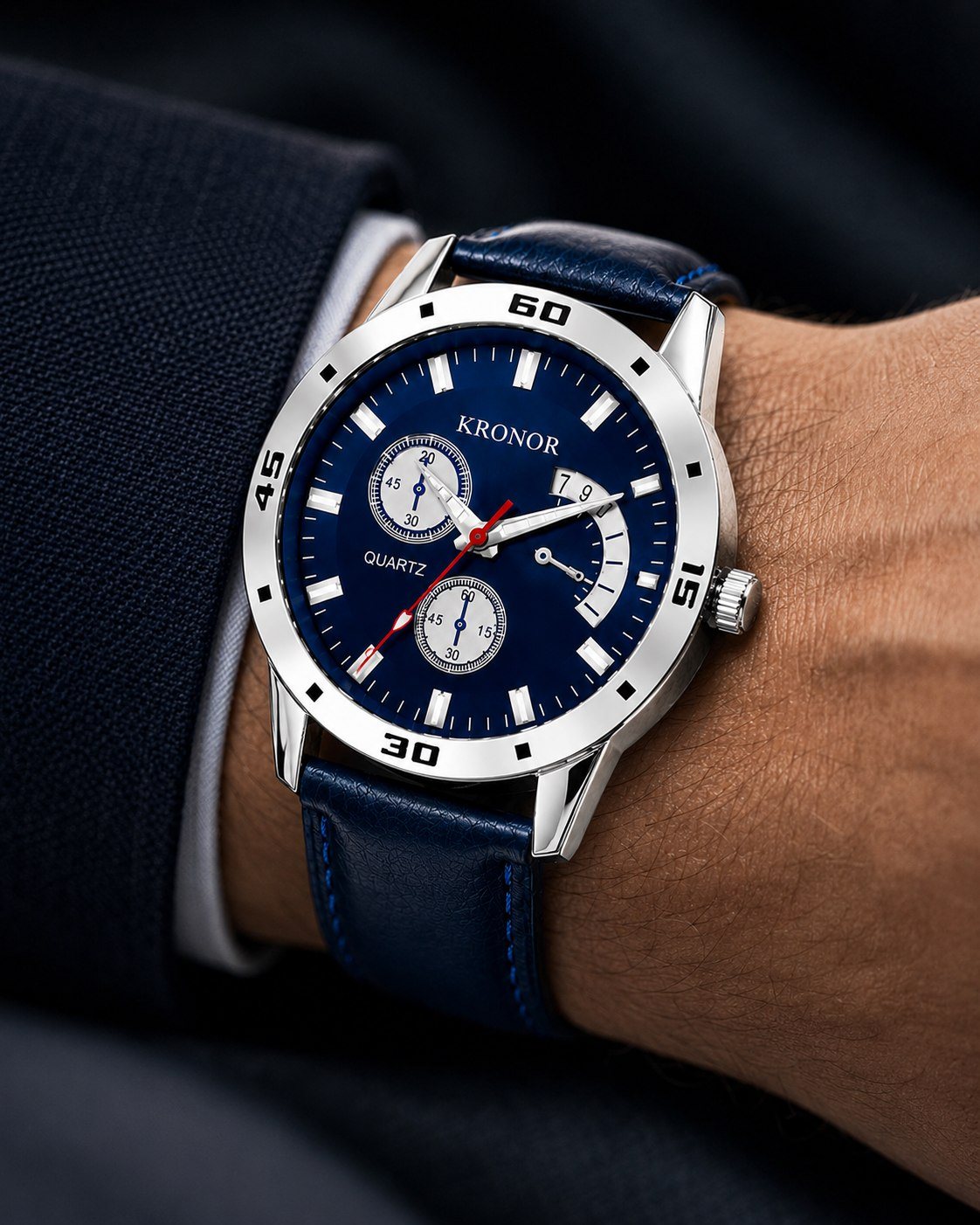 KRONOR MERIDIEN worn on the wrist with a navy suit