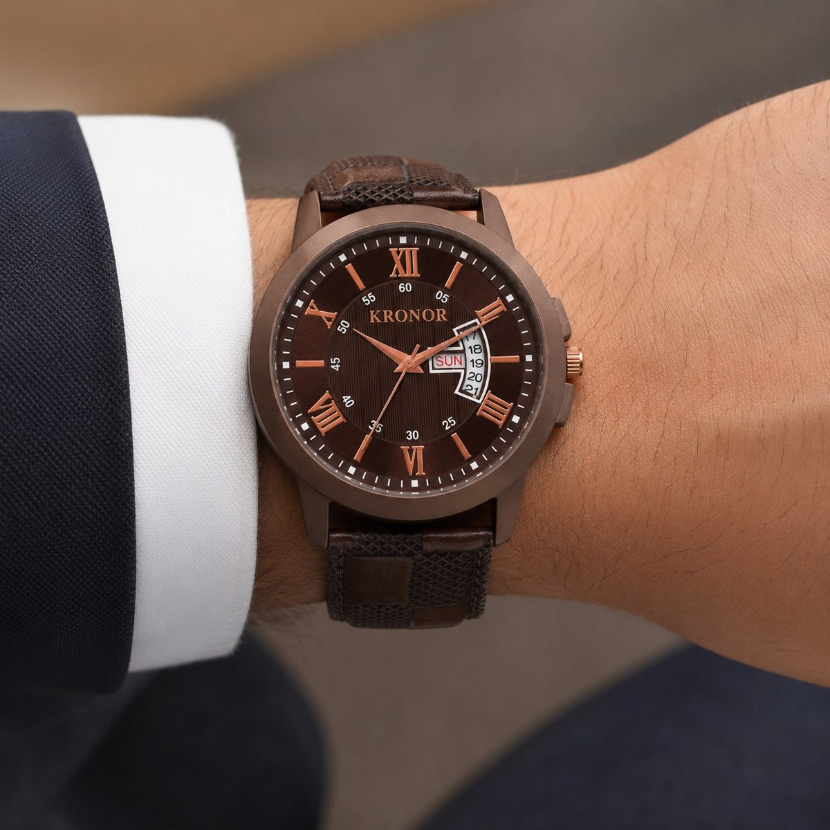 KRONOR VIREO worn on the wrist with a shirt cuff